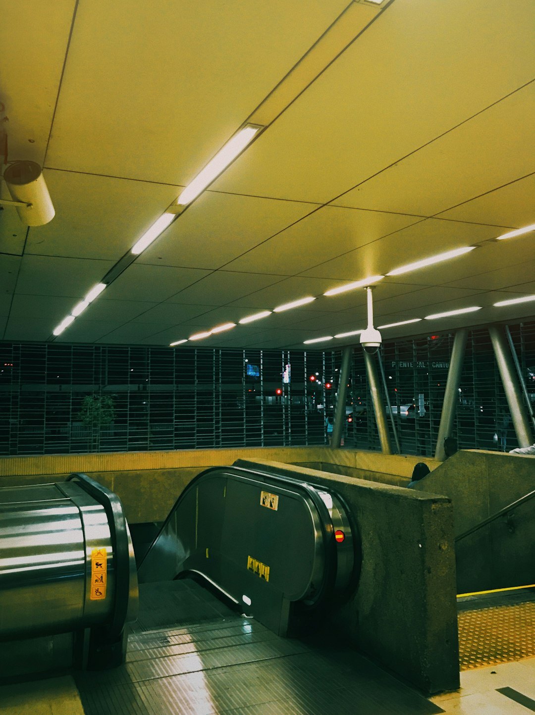 Commuters walking through a busy Santiago metro station