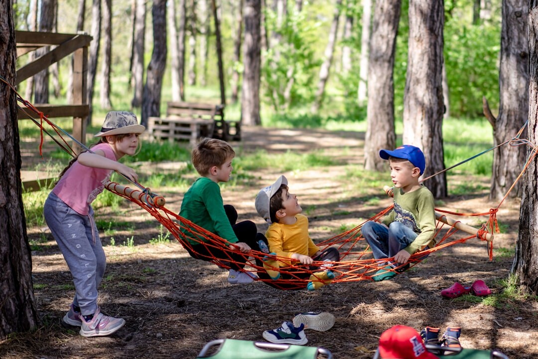 woman teaching children outdoors