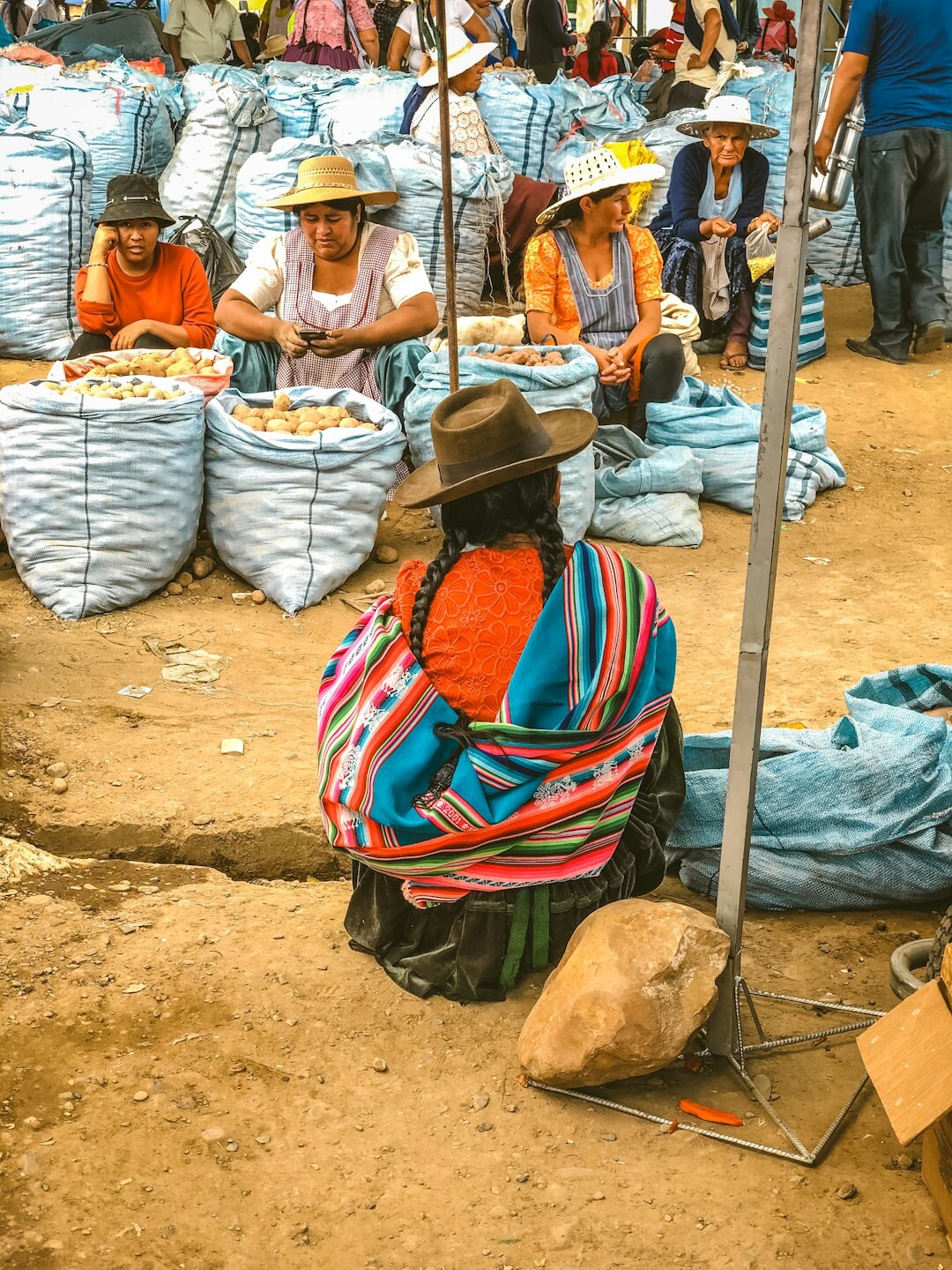 Elderly Chilean woman selling vegetables at a street market